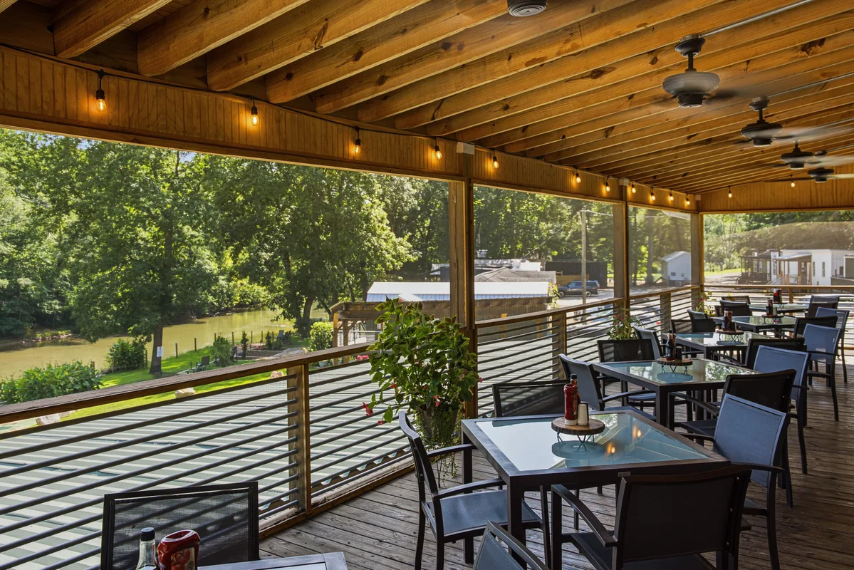 Wooden tables and reclaimed timber inside The Oxbow